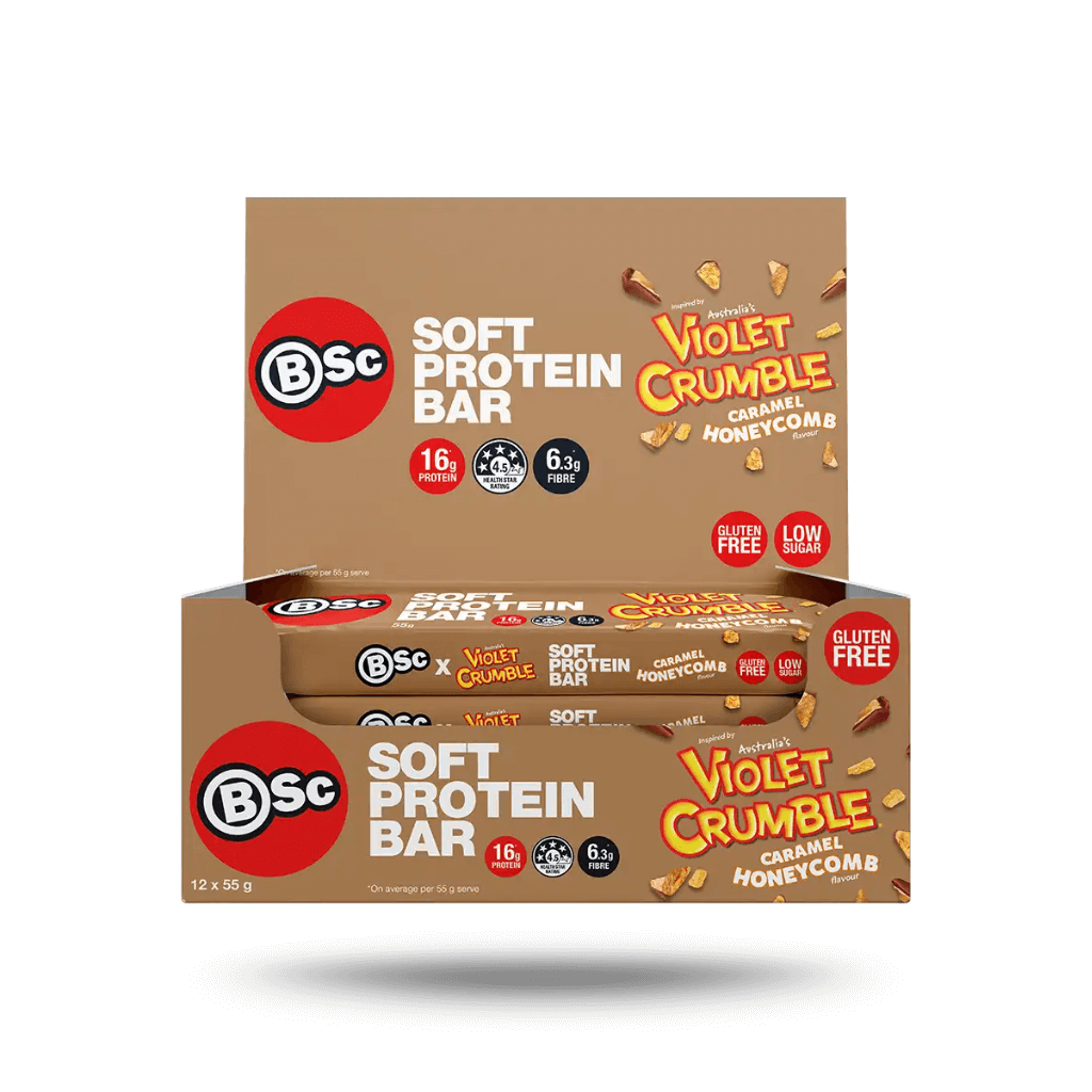 Athlete enjoying a meal replacement bar with low sugar after workout