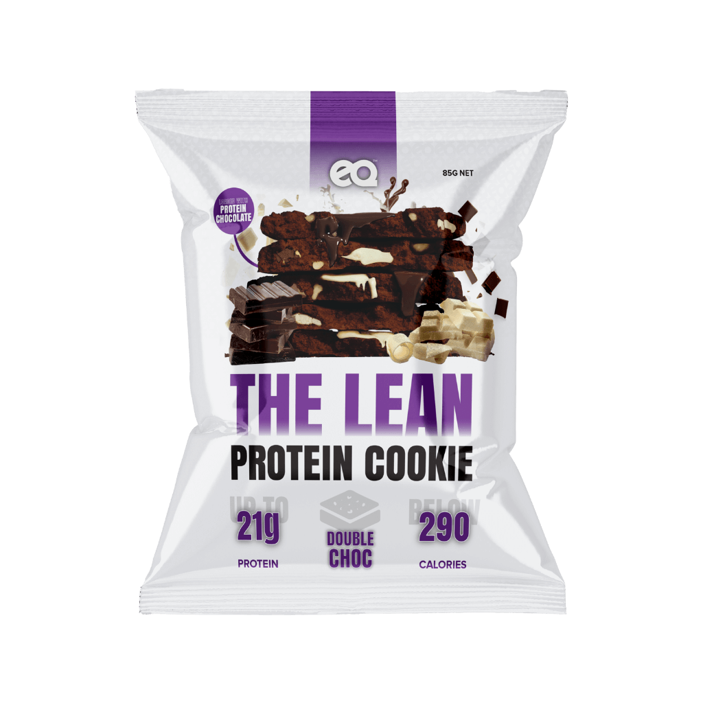 A person enjoying a Nourish & Thrive Protein Cookie during a workout break, emphasizing its role as a guilt-free snack.