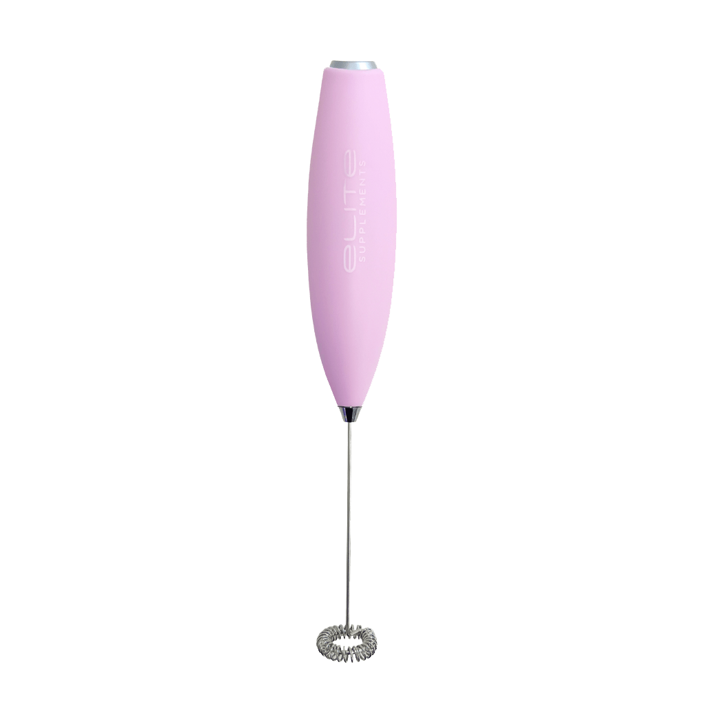 Angle view of BlendEase Pro electric hand mixer on a kitchen counter with smoothie ingredients