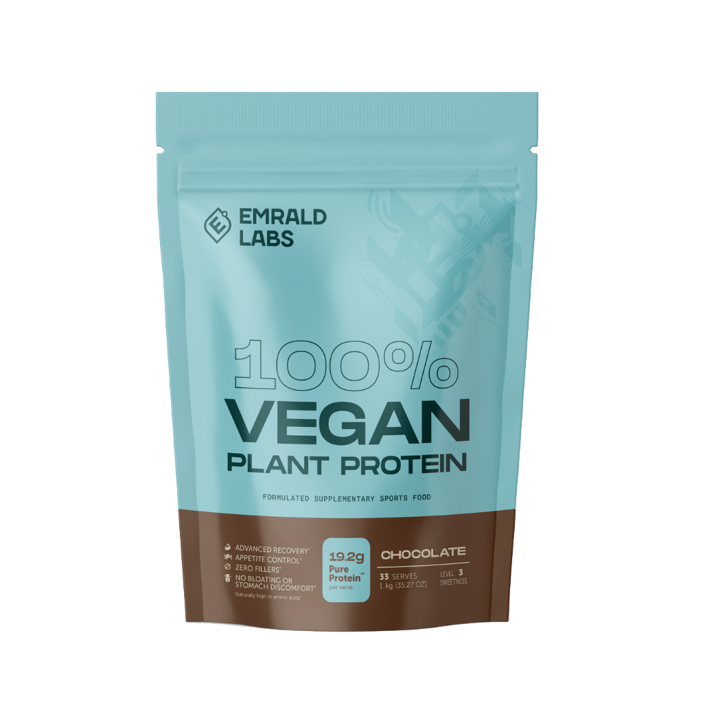 Scoop of vegan protein powder shown in natural light with a fruit backdrop.