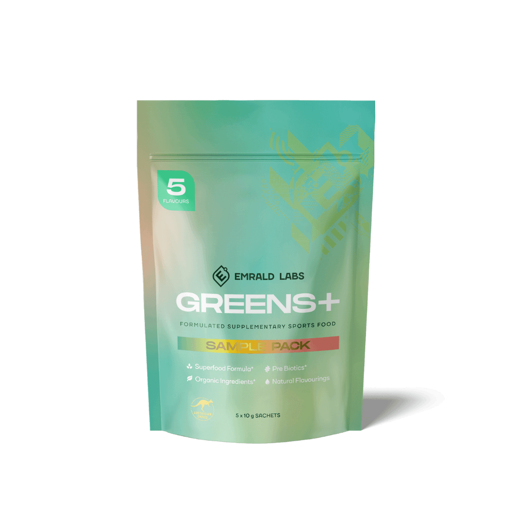 Emrald Labs Superfood Greens Variety Pack with vibrant green powder and fresh fruits, ideal for smoothies.