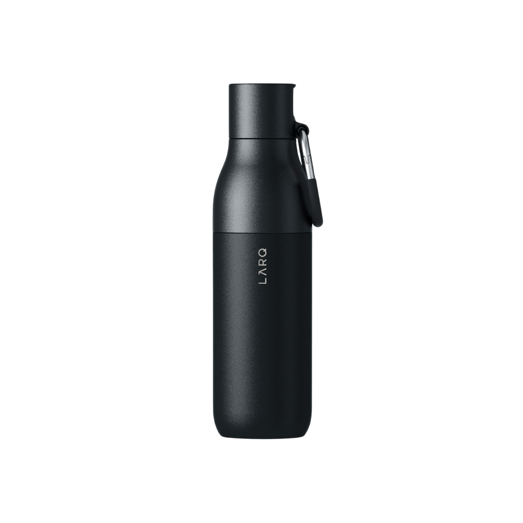 PureFlow reusable filtered water bottle with spill-proof flip top in use during outdoor hike