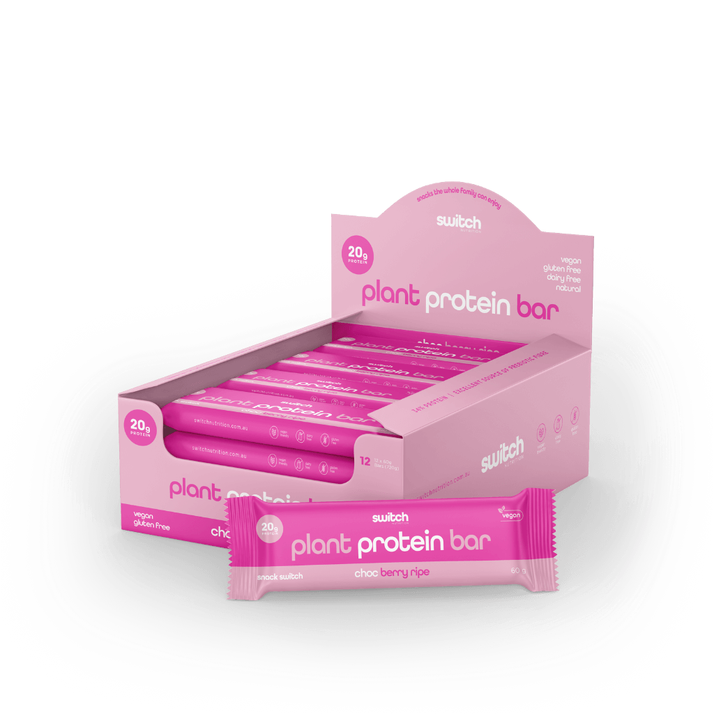 Energize Plant-Based Protein Bar on a gym bench, perfect for fitness enthusiasts looking for a high protein snack.