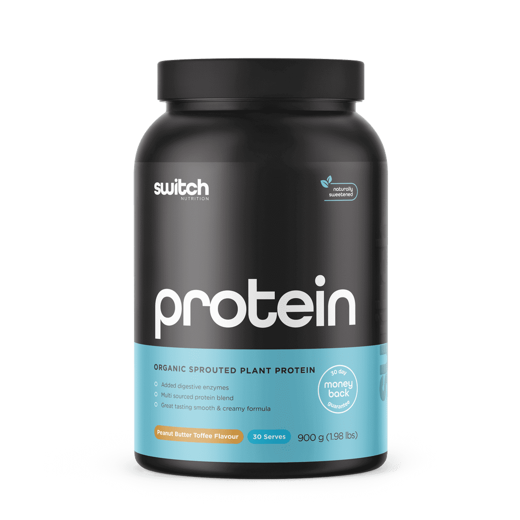 Scoop of Vital Greens Protein Blend next to fresh ingredients highlighting its organic and vegan nature.
