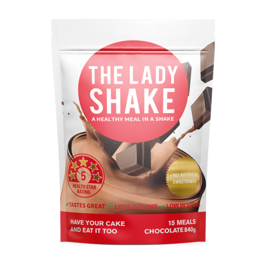 Close-up of LadyFit protein shake in a glass with fresh berries, emphasizing taste and health benefits