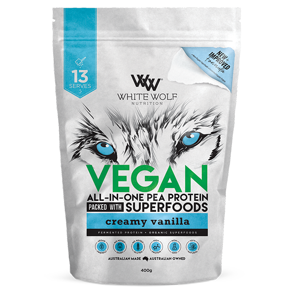 Close-up of creamy vegan protein powder being mixed into a shake