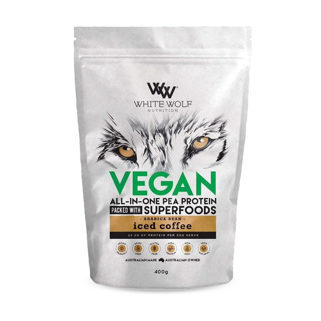 Close-up of creamy vegan protein powder being mixed into a shake